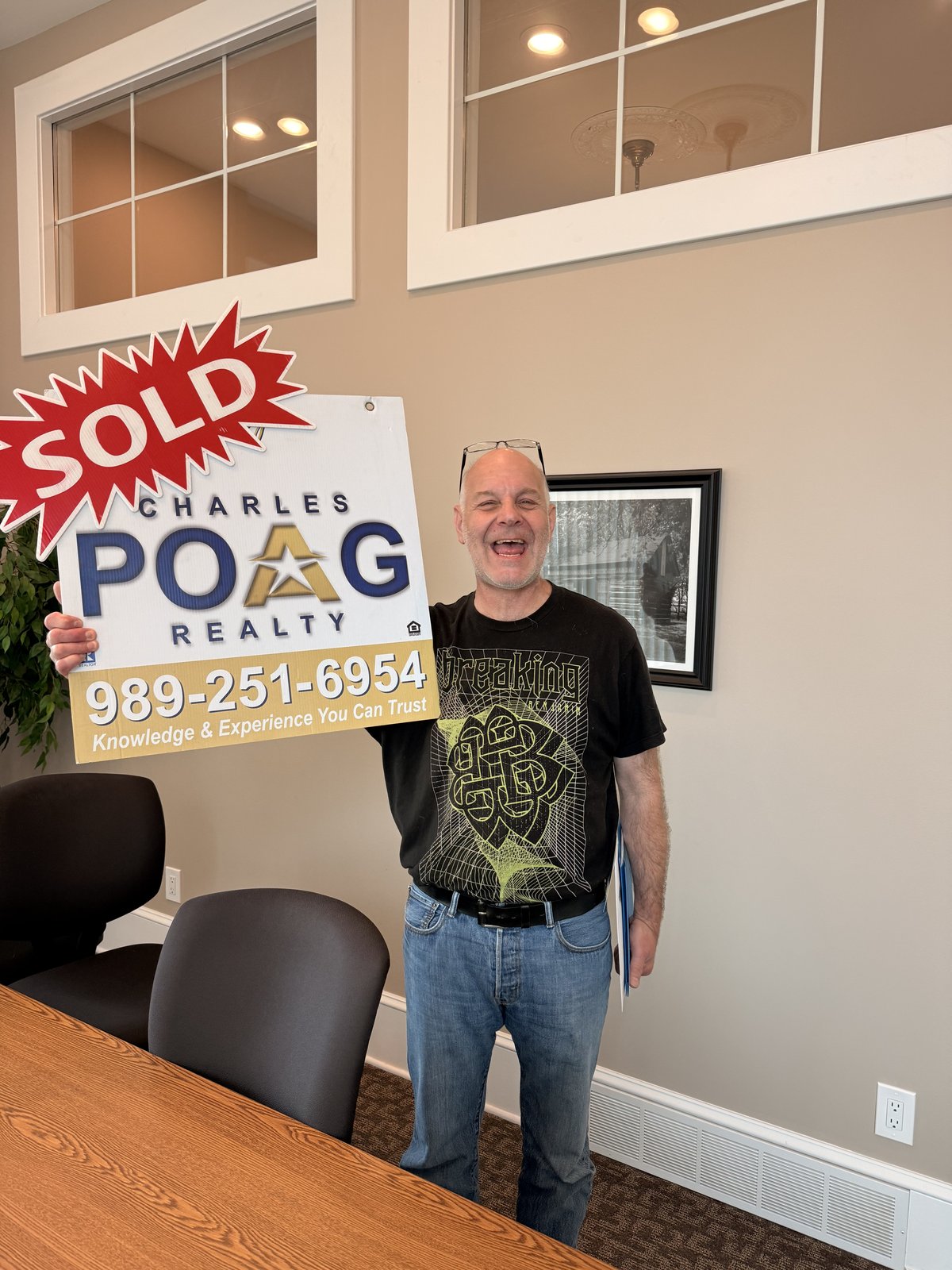 Charles Poag with clients at closing