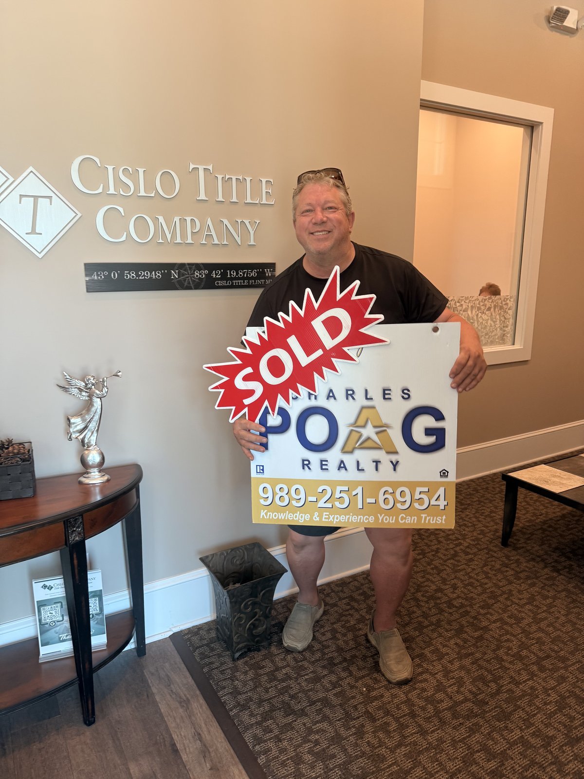 Charles Poag with clients at closing