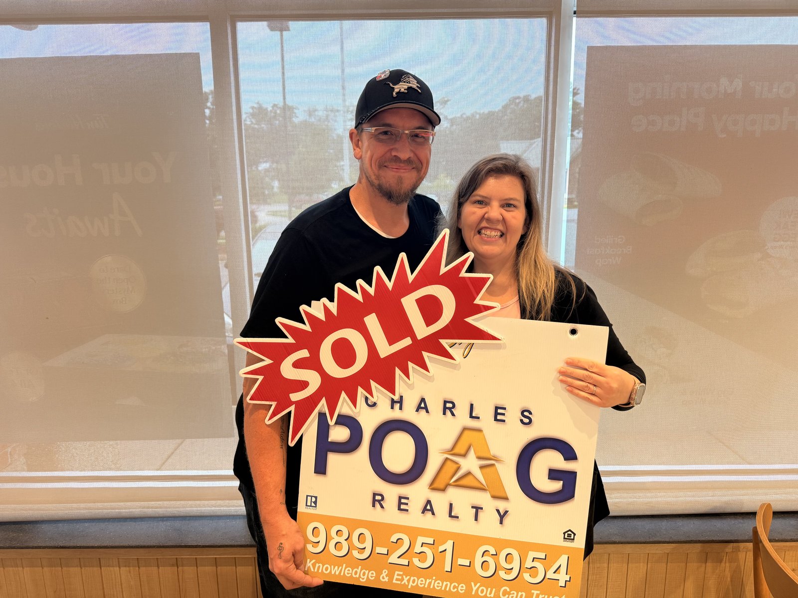Charles Poag with clients at closing