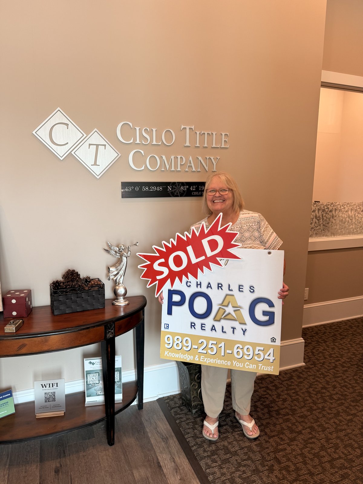 Charles Poag with clients at closing